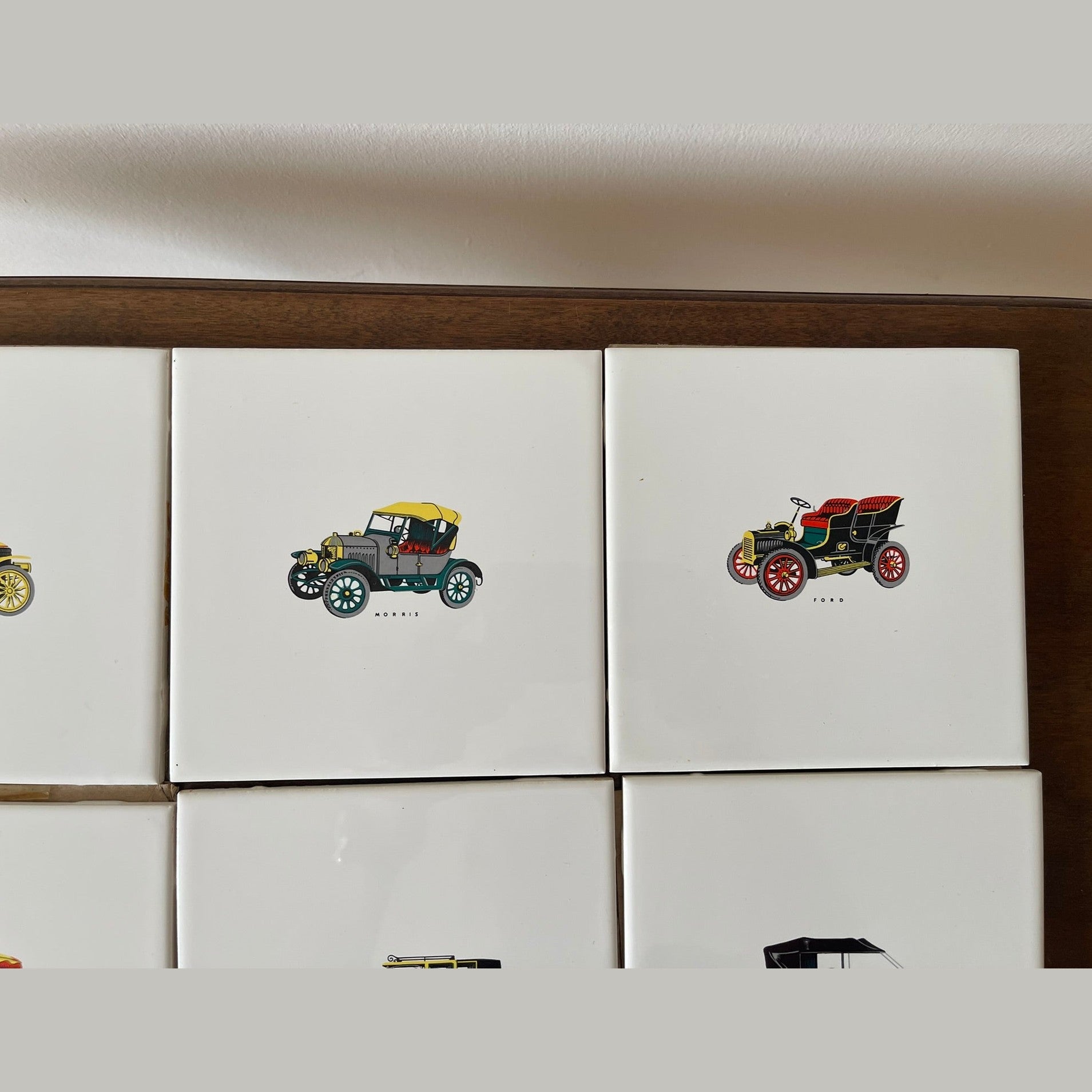Vintage set of 8 Pilkington carter wall tiles with vintage cars printed on.