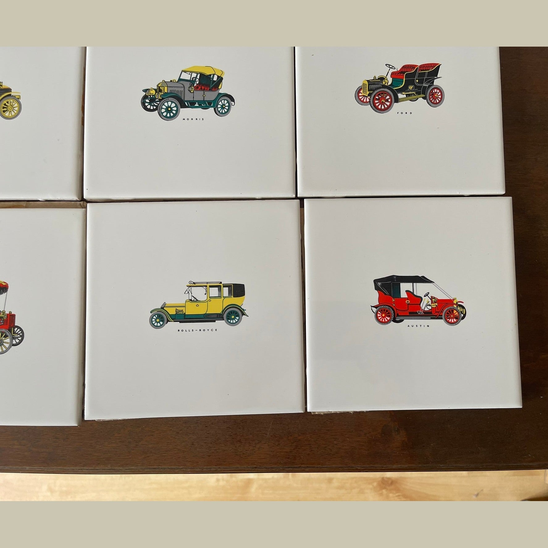 Vintage set of 8 Pilkington carter wall tiles with vintage cars printed on.