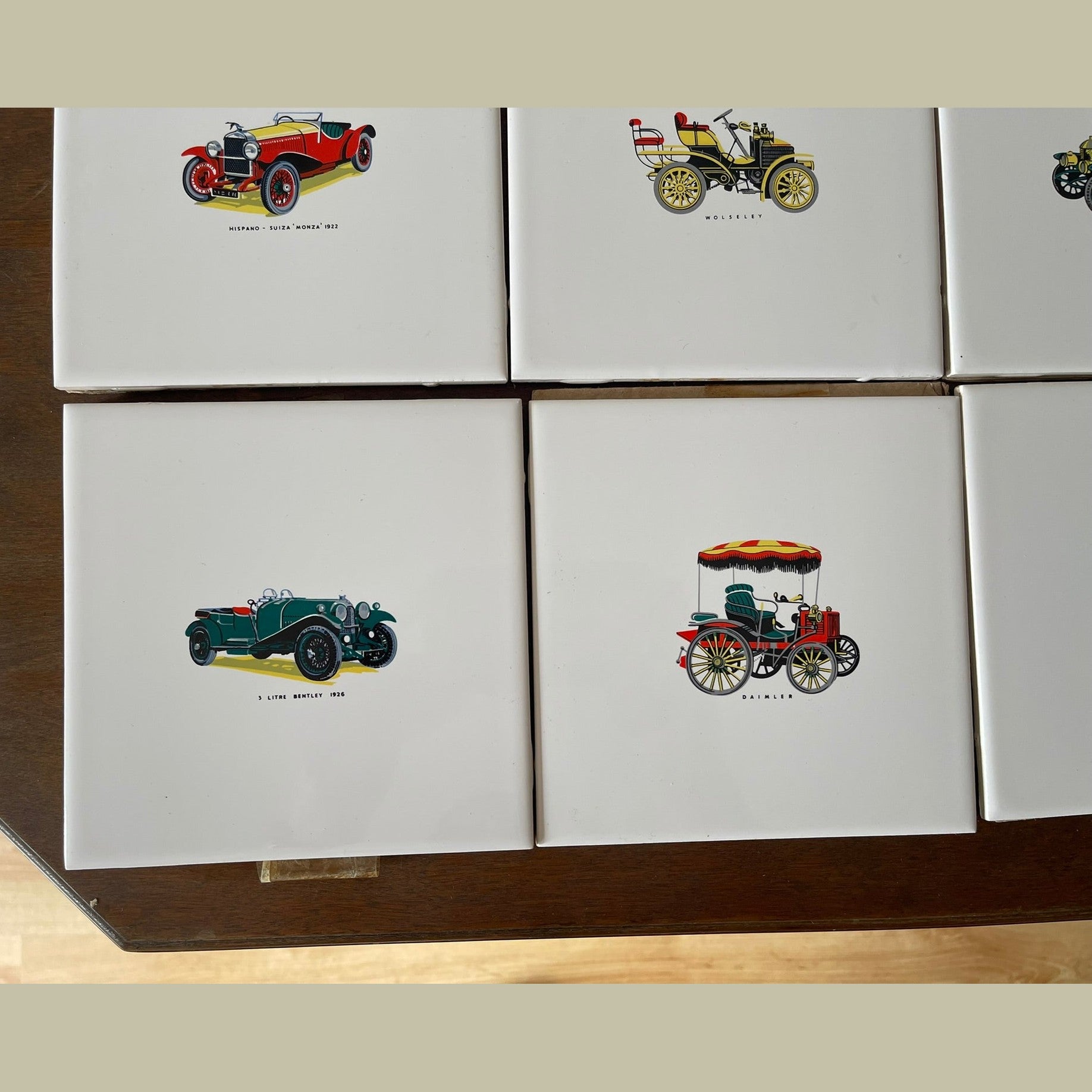 Vintage set of 8 Pilkington carter wall tiles with vintage cars printed on.