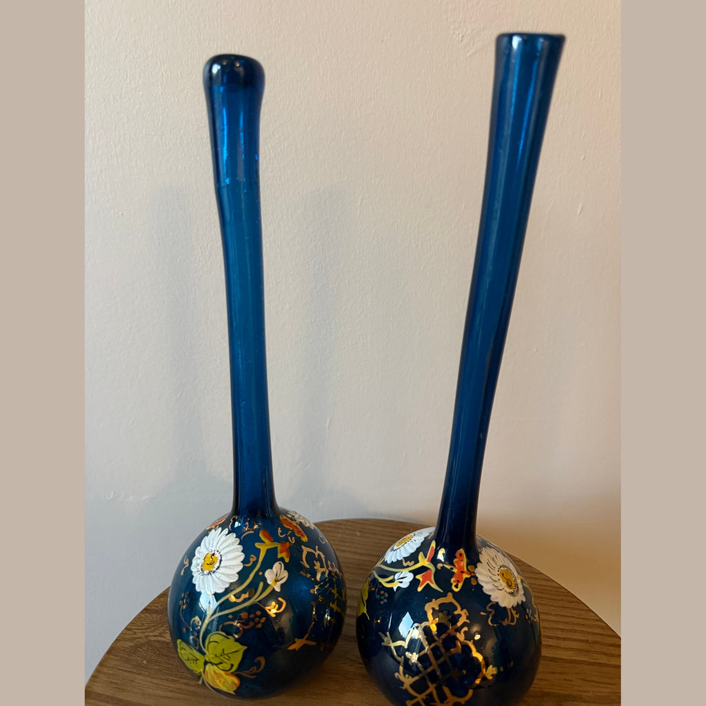 Pair of hand blown blue glass 19th century Persian rose water sprinklers/ bud vases, hand painted enamelled flower and gilt decoration. Measures 29.5cm tall.