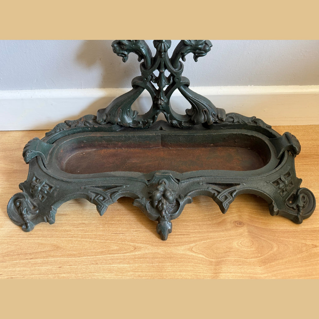 Dark green cast iron stick stand base Gothic flourishes worn patina