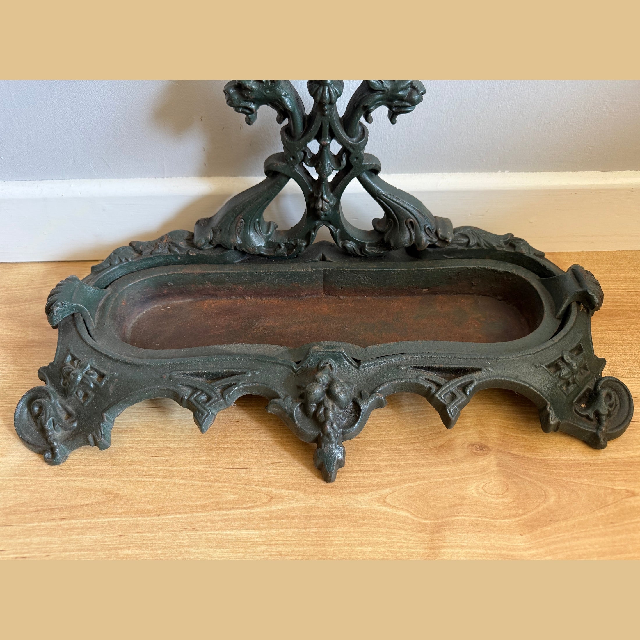 Dark green cast iron stick stand base Gothic flourishes worn patina