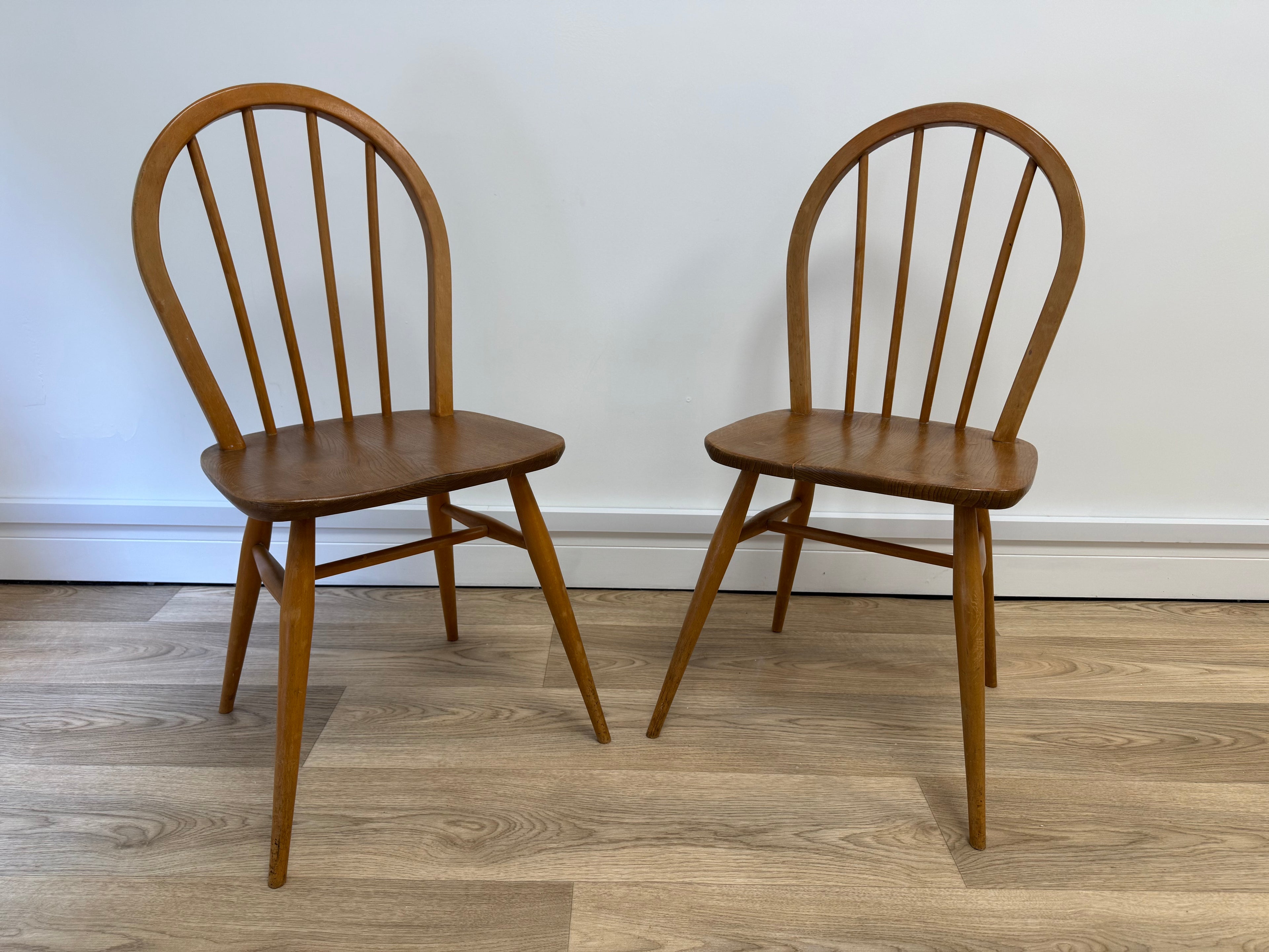A pair of Vintage Ercol Model 400 dining chairs.