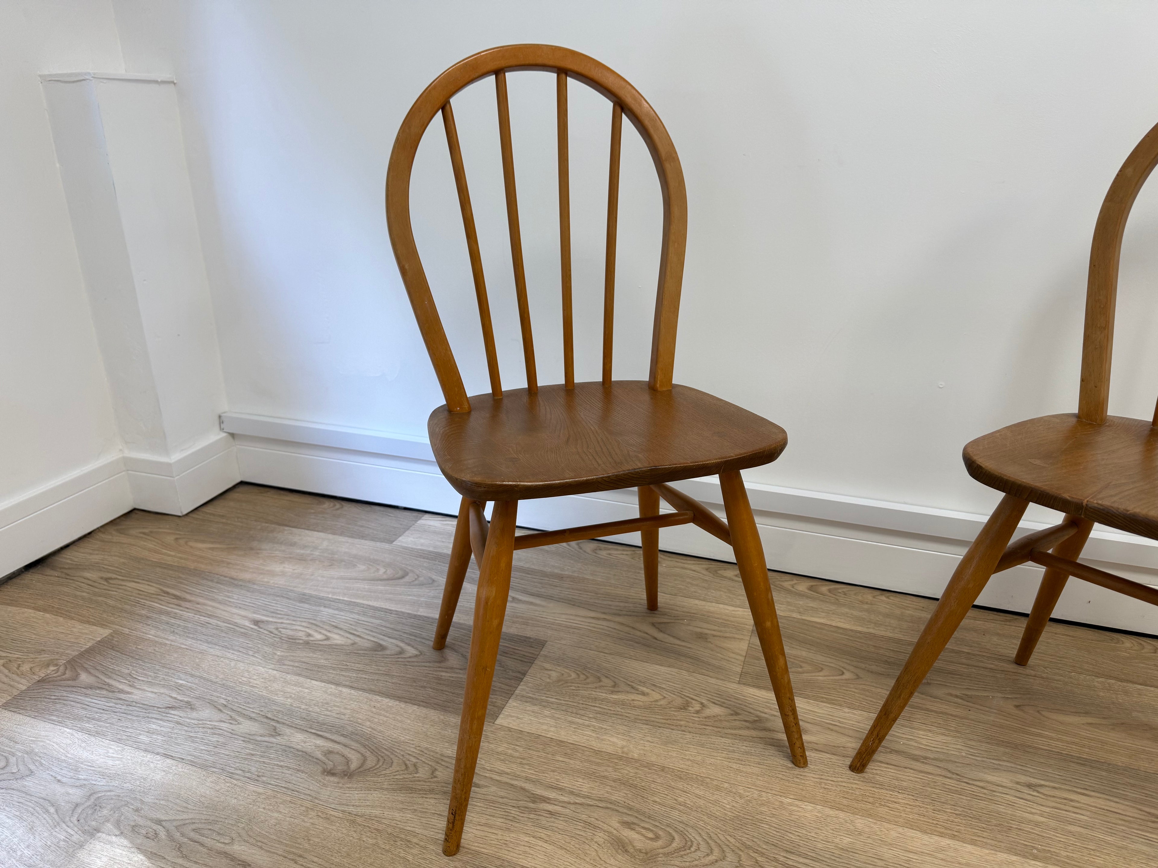A pair of Vintage Ercol Model 400 dining chairs.