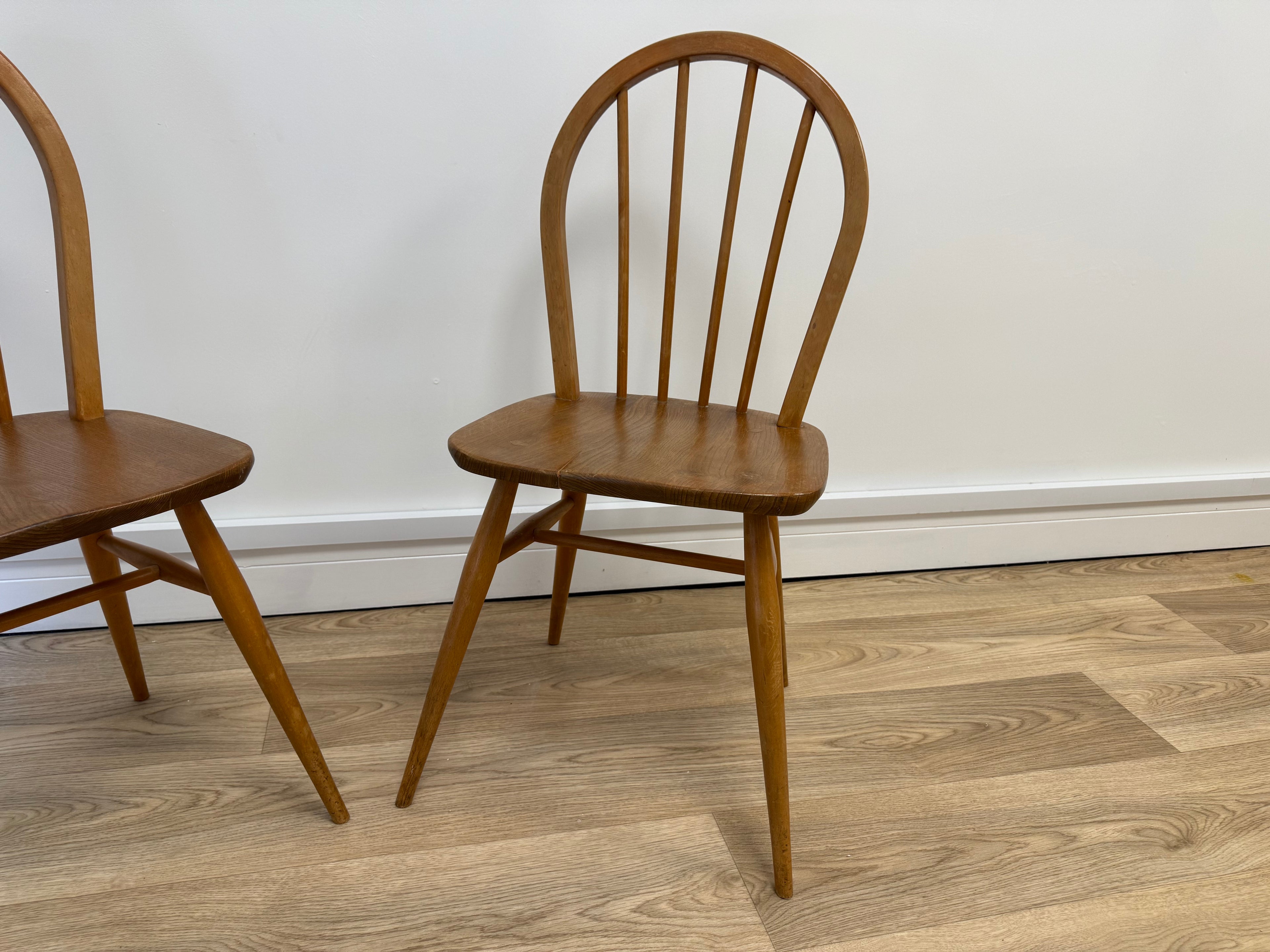 A pair of Vintage Ercol Model 400 dining chairs.