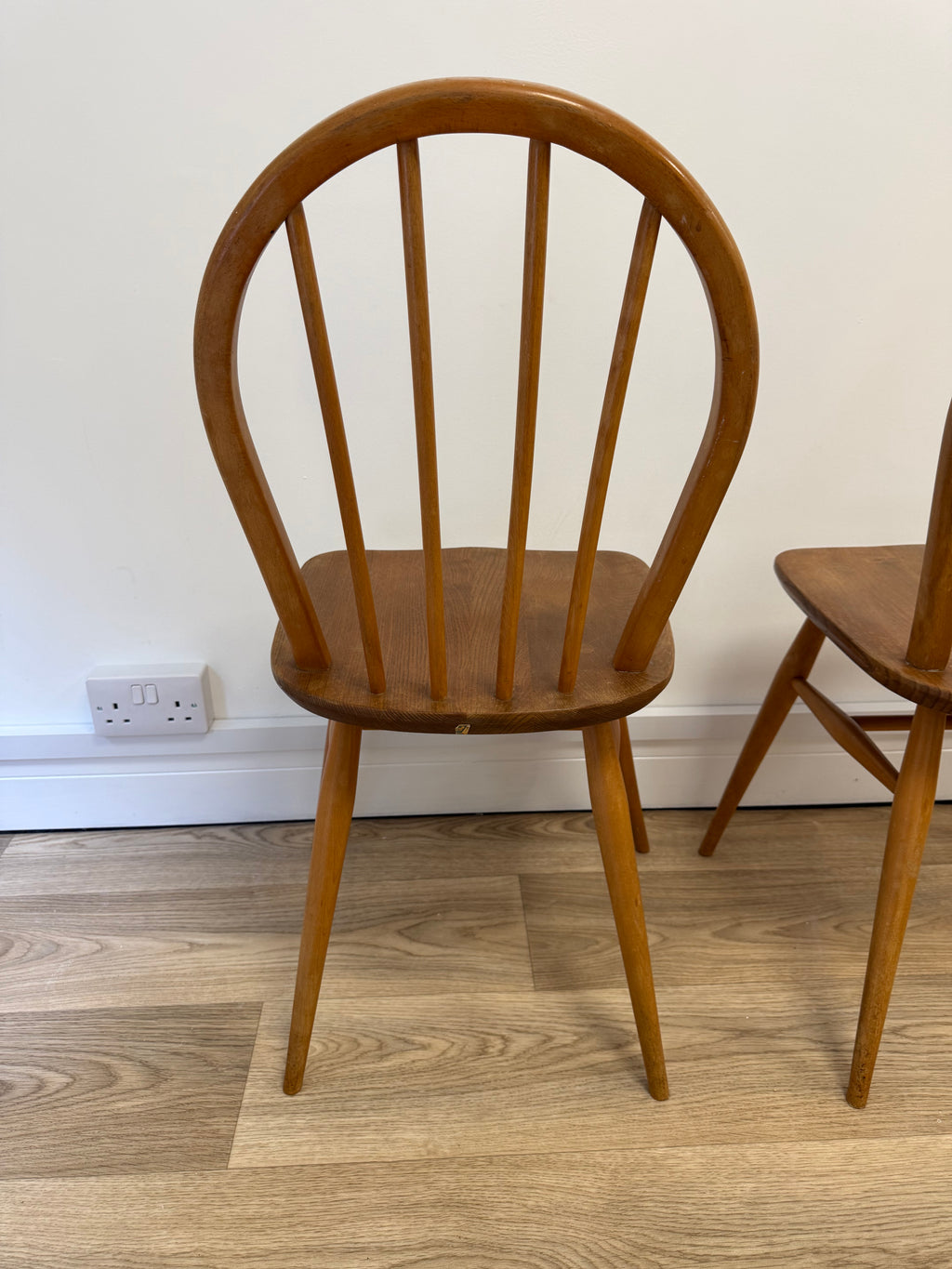 A pair of Vintage Ercol Model 400 dining chairs.