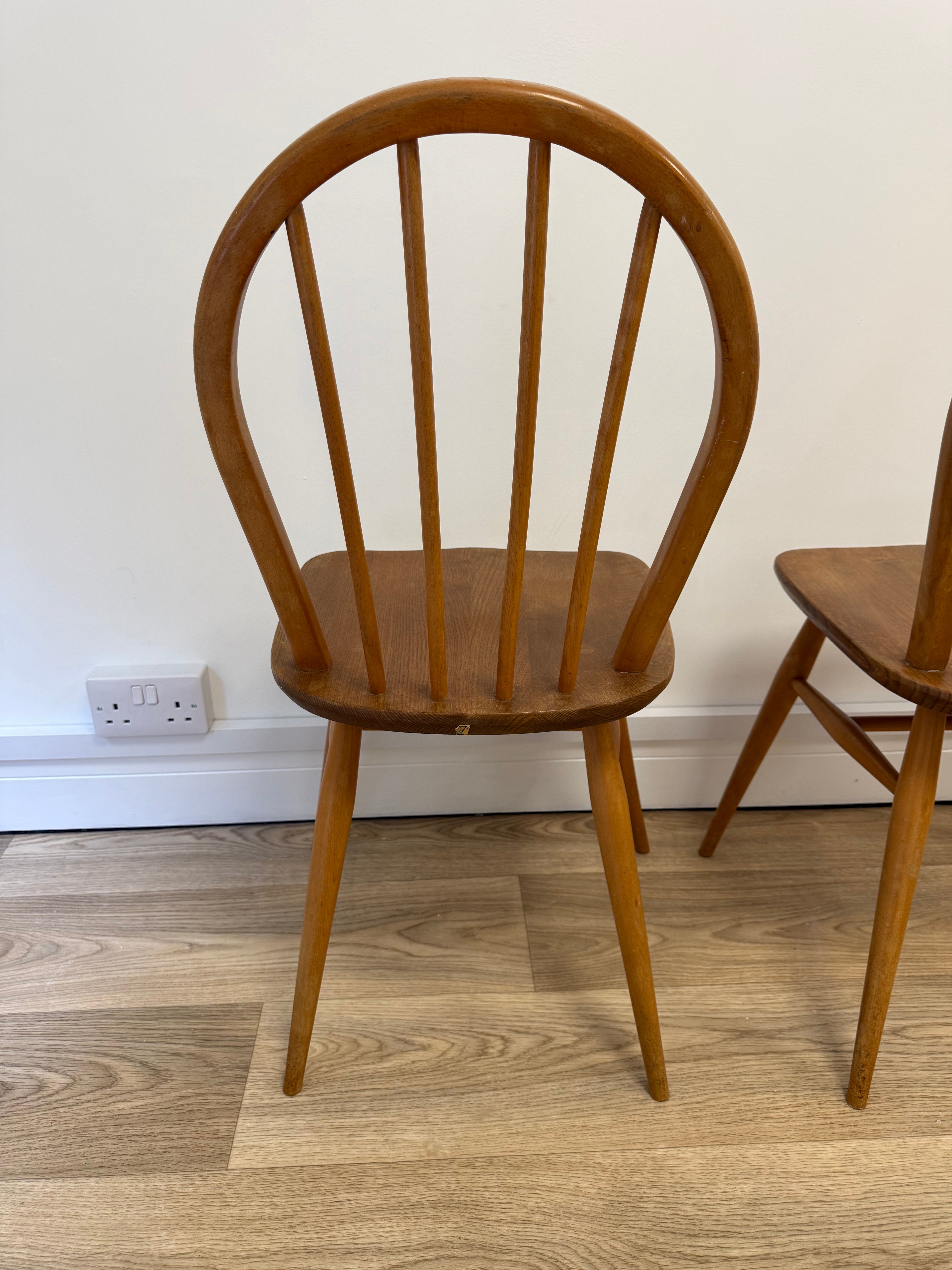 A pair of Vintage Ercol Model 400 dining chairs.